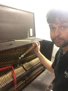 Tuning an old upright at WMBR radio